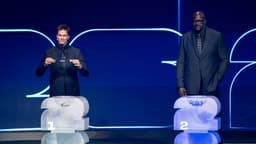 Former National Football League (NFL) Quarterback and seven-time Super Bowl champion Tom Brady draws Spain as Four-time National Basketball Association (NBA) championship winner and Hall of Famer Shaquille O Neal looks on