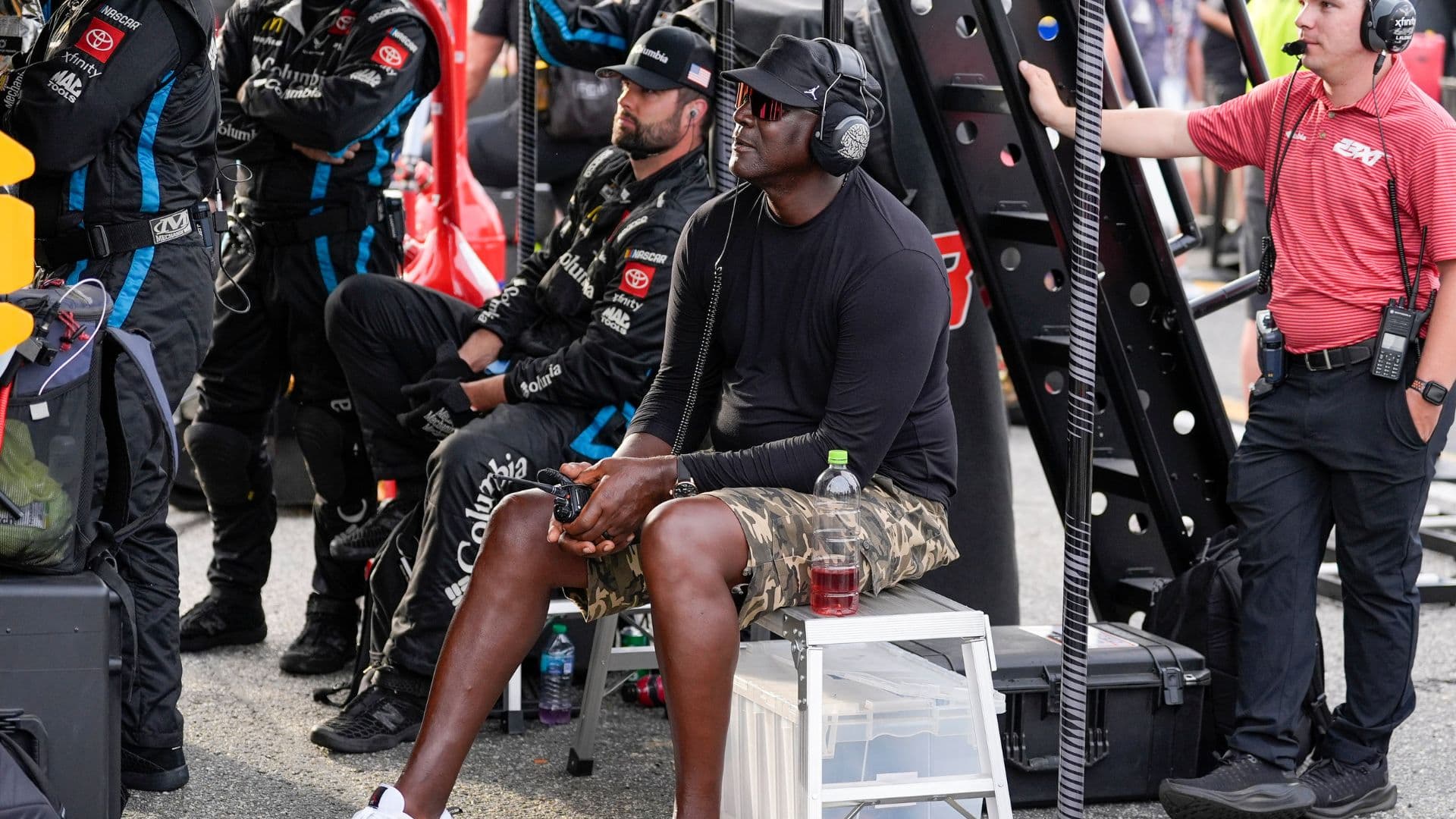 Apr 6, 2025; Darlington, South Carolina, USA; NASCAR Cup Series driver Tyler Reddick (45) team owner Michael Jordan watches his racer during the Goodyear 400 at Darlington Raceway.