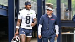 New England Patriots wide receiver Stefon Diggs (8) and offensive coordinator Josh McDaniels walk to the practice fields at Gillette Stadium.