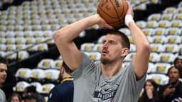 Dec 20, 2025; Denver, Colorado, USA; Denver Nuggets center Nikola Jokic (15) warms up before the game against the Houston Rockets at Ball Arena.