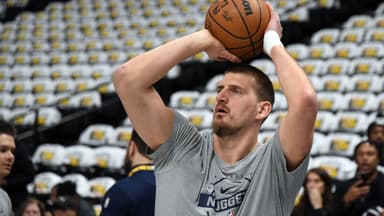 Dec 20, 2025; Denver, Colorado, USA; Denver Nuggets center Nikola Jokic (15) warms up before the game against the Houston Rockets at Ball Arena.