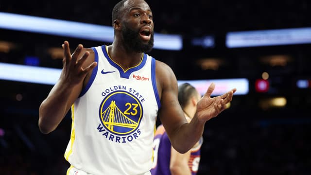 Dec 18, 2025; Phoenix, Arizona, USA; Golden State Warriors forward Draymond Green (23) reacts against the Phoenix Suns at Mortgage Matchup Center.