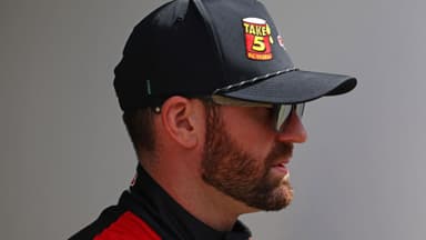 Feb 16, 2025; Daytona Beach, Florida, USA; NASCAR Cup Series driver Corey LaJoie (01) walks to the drivers meeting before the Daytona 500 at Daytona International Speedway.