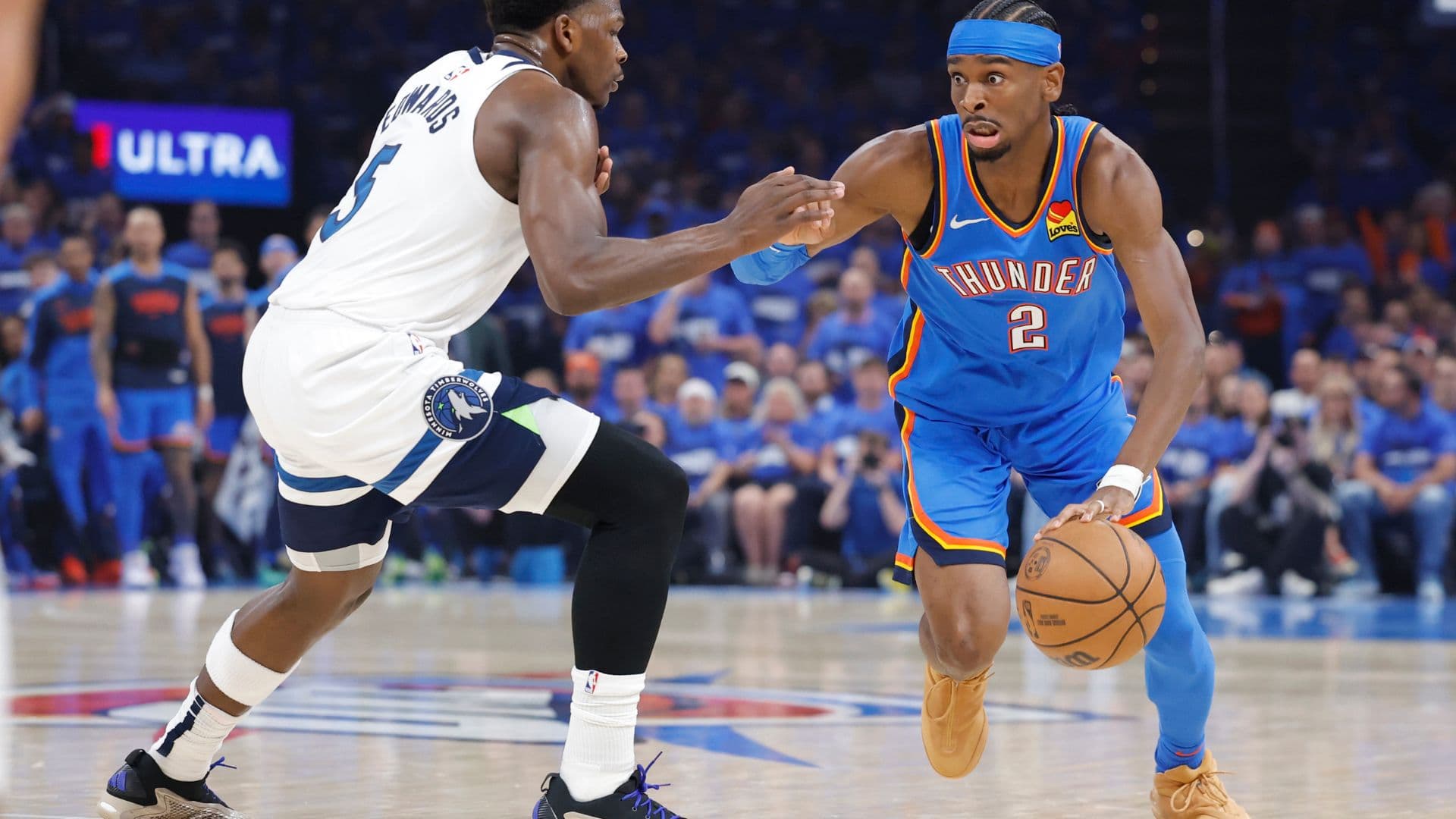 May 22, 2025; Oklahoma City, Oklahoma, USA; Oklahoma City Thunder guard Shai Gilgeous-Alexander (2) drives against Minnesota Timberwolves guard Anthony Edwards (5) in the first quarter during game two of the western conference finals for the 2025 NBA Playoffs at Paycom Center