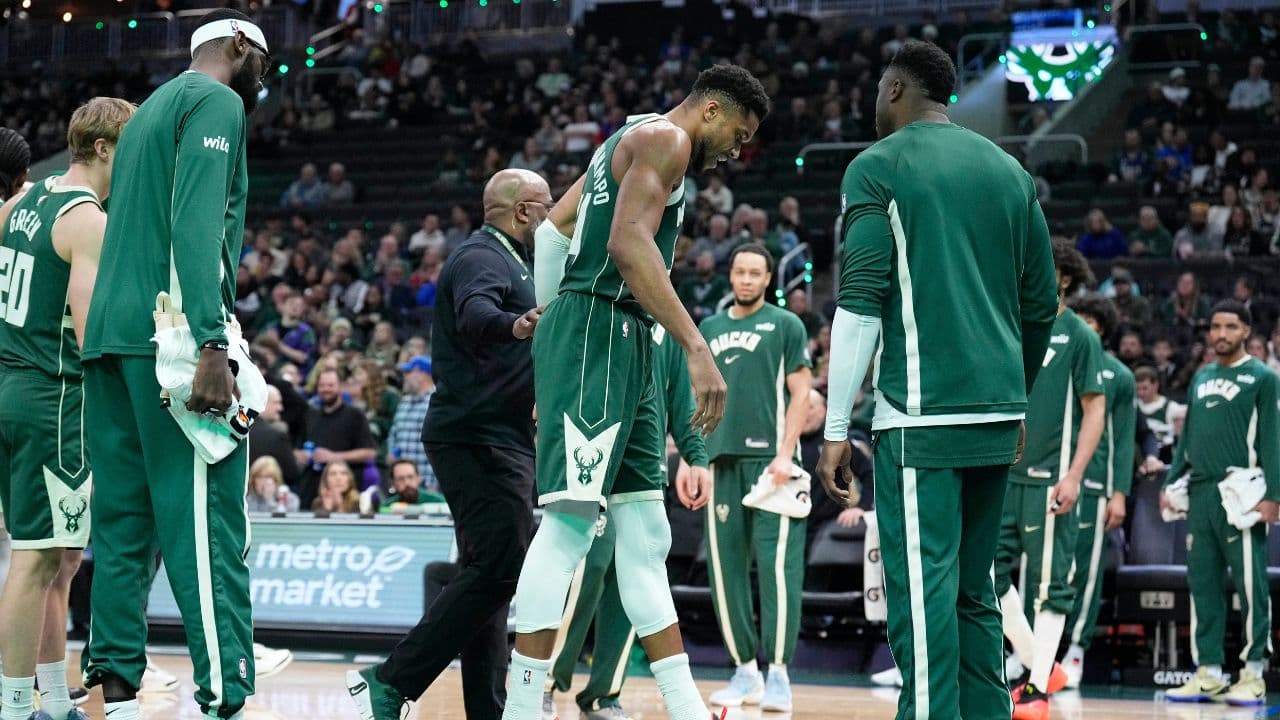 Dec 3, 2025; Milwaukee, Wisconsin, USA; Milwaukee Bucks forward Giannis Antetokounmpo (34) grimaces as he limps off the court after going down with an injury in the first half against the Detroit Pistons at Fiserv Forum. Mandatory Credit: Michael McLoone-Imagn Images