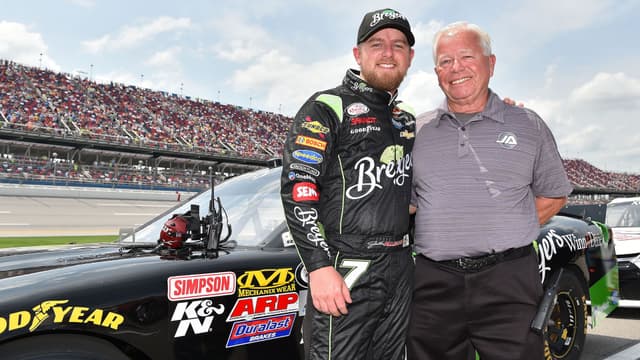 Apr 30, 2016; Talladega, AL, USA; NASCAR Xfinity Series driver Justin Allgaier (left) and his father Mike Allgaier (right) pose for a photo before the Sparks Energy 300 at Talladega Superspeedway