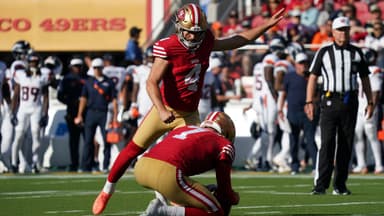 San Francisco 49ers kicker Jake Moody (4) kicks an extra point as punter Thomas Morstead (7) holds the ball in the first quarter against the Denver Broncos at Levi's Stadium