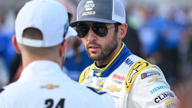 Sep 6, 2025; Madison, Illinois, USA; NASCAR Cup Series driver Chase Elliott (9) speaks with NASCAR Cup Series driver William Byron (24) during practice and qualifying for the Enjoy Illinois 300 at World Wide Technology Raceway.