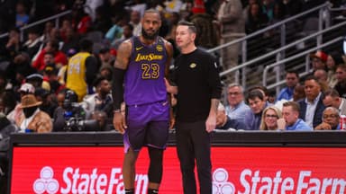 Dec 6, 2024; Atlanta, Georgia, USA; Los Angeles Lakers forward LeBron James (23) talks to head coach JJ Redick against the Atlanta Hawks in the second quarter at State Farm Arena