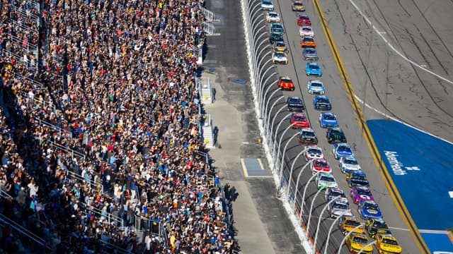 Feb 19, 2024; Daytona Beach, Florida, USA; NASCAR Cup Series driver Joey Logano (22) and Michael McDowell (34) lead the field to the green flag during the Daytona 500 at Daytona International Speedway.