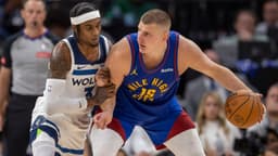 May 10, 2024; Minneapolis, Minnesota, USA; Denver Nuggets center Nikola Jokic (15) controls the ball as Minnesota Timberwolves forward Jaden McDaniels (3) defends in the second half during game three of the second round for the 2024 NBA playoffs at Target Center.