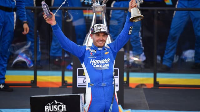 Nov 2, 2025; Avondale, Arizona, USA; NASCAR Cup Series driver Kyle Larson (5) celebrates his championship victory following the Cup Series Championship race at Phoenix Raceway.