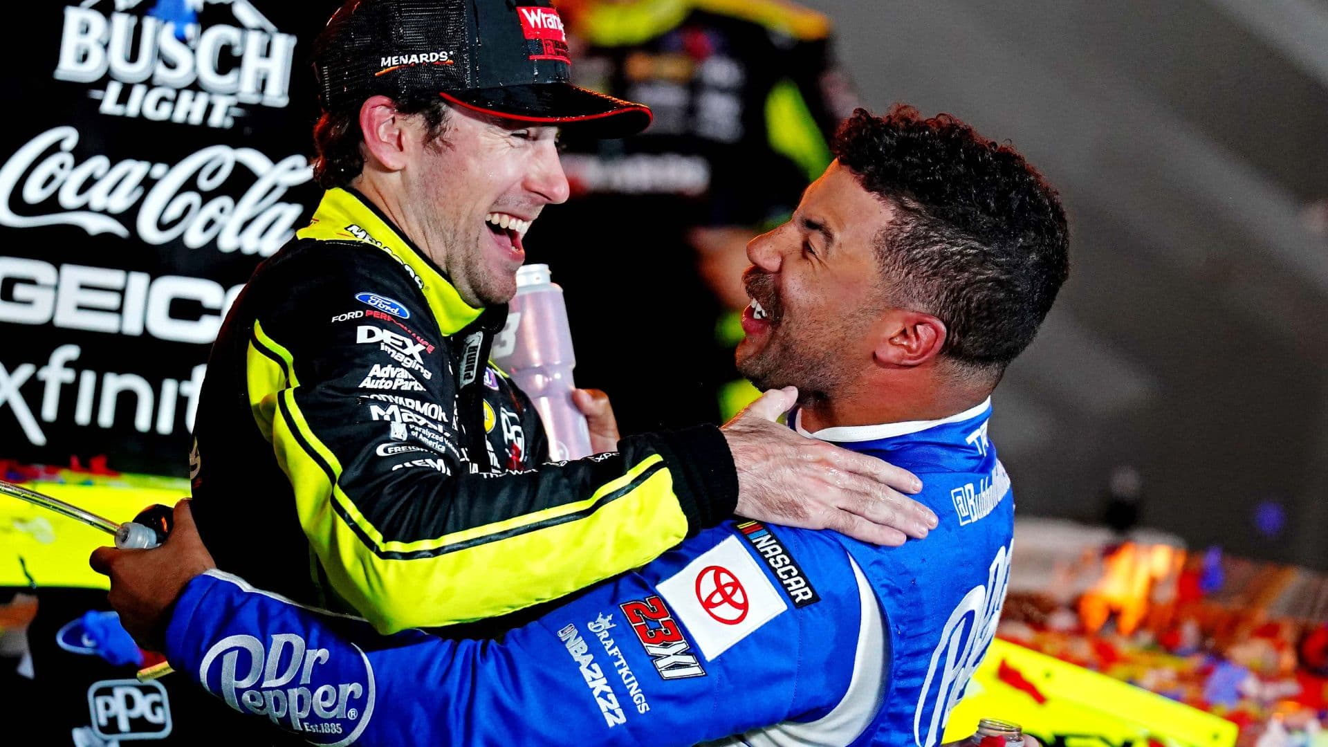 May 22, 2022; Fort Worth, Texas, USA; NASCAR Cup Series driver Ryan Blaney (12) celebrates in Victory lane with NASCAR Cup Series driver Bubba Wallace (23) after winning the All-Star Race at Texas Motor Speedway