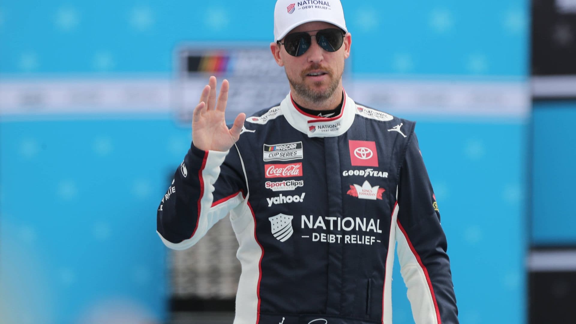 DAYTONA BEACH, FL - FEBRUARY 16: Denny Hamlin ( 11 Joe Gibbs Racing National Debt Relief Toyota) waves to the fans prior to the running of the NASCAR, Motorsport, USA Cup Series Daytona 500 on February 16, 2025 at Daytona International Speedway in Daytona Beach, FL