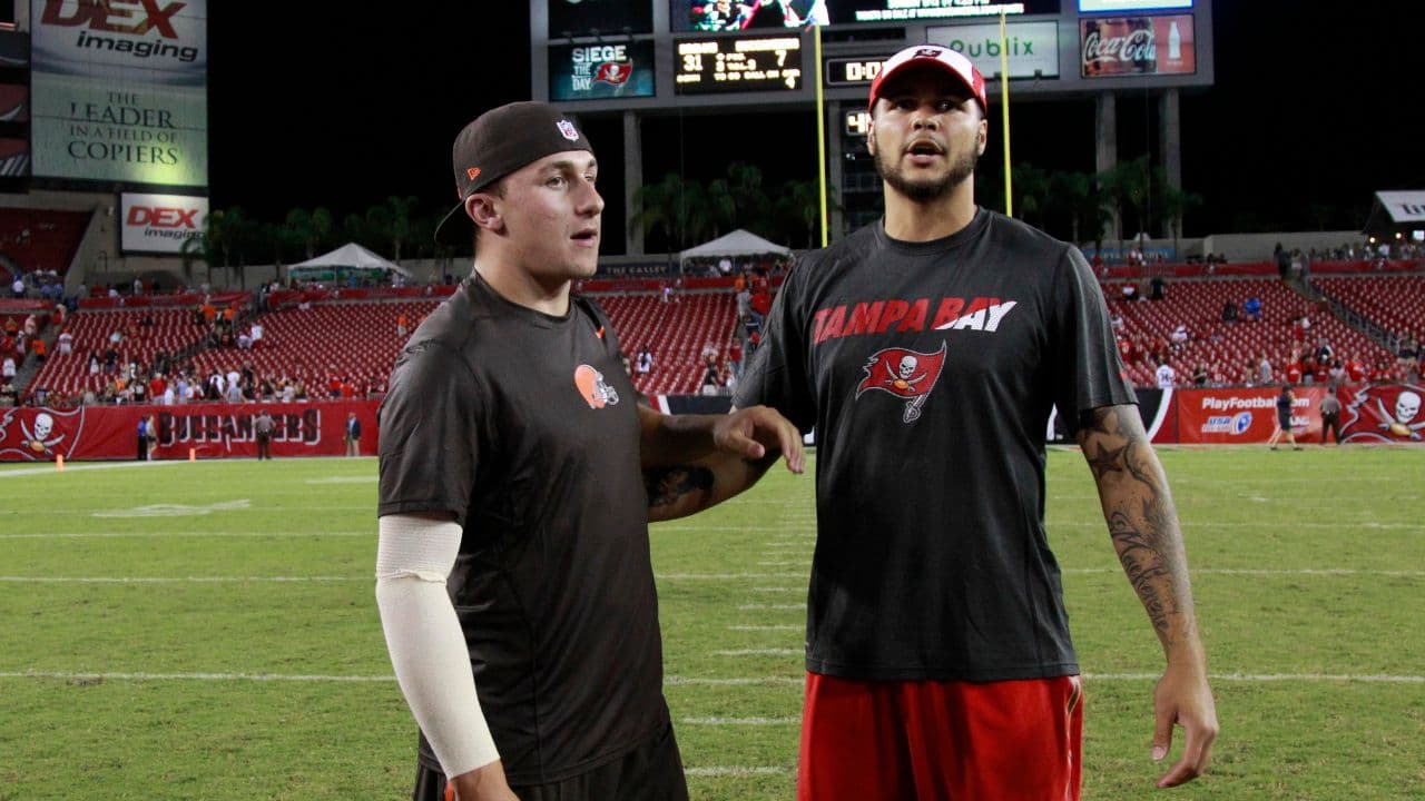 Cleveland Browns quarterback Johnny Manziel (2) and Tampa Bay Buccaneers wide receiver Mike Evans (13) talk after the game at Raymond James Stadium. Cleveland Browns defeated the Tampa Bay Buccaneers 31-7.