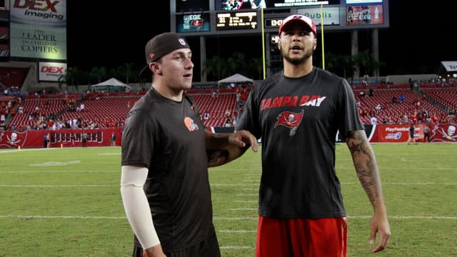 Cleveland Browns quarterback Johnny Manziel (2) and Tampa Bay Buccaneers wide receiver Mike Evans (13) talk after the game at Raymond James Stadium. Cleveland Browns defeated the Tampa Bay Buccaneers 31-7.