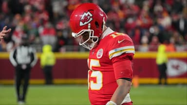 Kansas City Chiefs quarterback Patrick Mahomes (15) lowers his head during the fourth quarter against the Houston Texans at GEHA Field at Arrowhead Stadium.