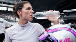 NASCAR Cup Series driver Katherine Legge (78) takes a sip of water Saturday, July 26, 2025, after her qualifying run for the Brickyard 400 at Indianapolis Motor Speedway.
