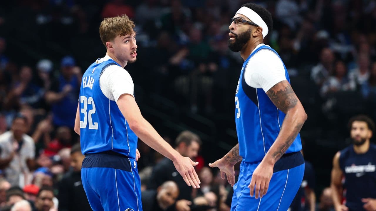 Dallas Mavericks forward Cooper Flagg (32) celebrates with Dallas Mavericks forward Anthony Davis (3) during the first quarter against the Washington Wizards at American Airlines Center.