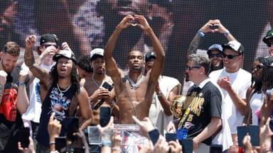 Jun 24, 2025; Oklahoma City, OK, USA; Oklahoma City Thunder guard Shai Gilgeous-Alexander, center, holds up a heart shape with his hands for fans during the Oklahoma City Thunder Champions parade