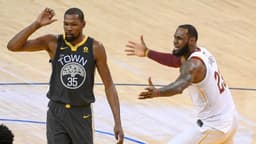June 3, 2018; Oakland, CA, USA; Golden State Warriors forward Kevin Durant (35) and Cleveland Cavaliers forward LeBron James (23) react during the third quarter in game two of the 2018 NBA Finals at Oracle Arena.