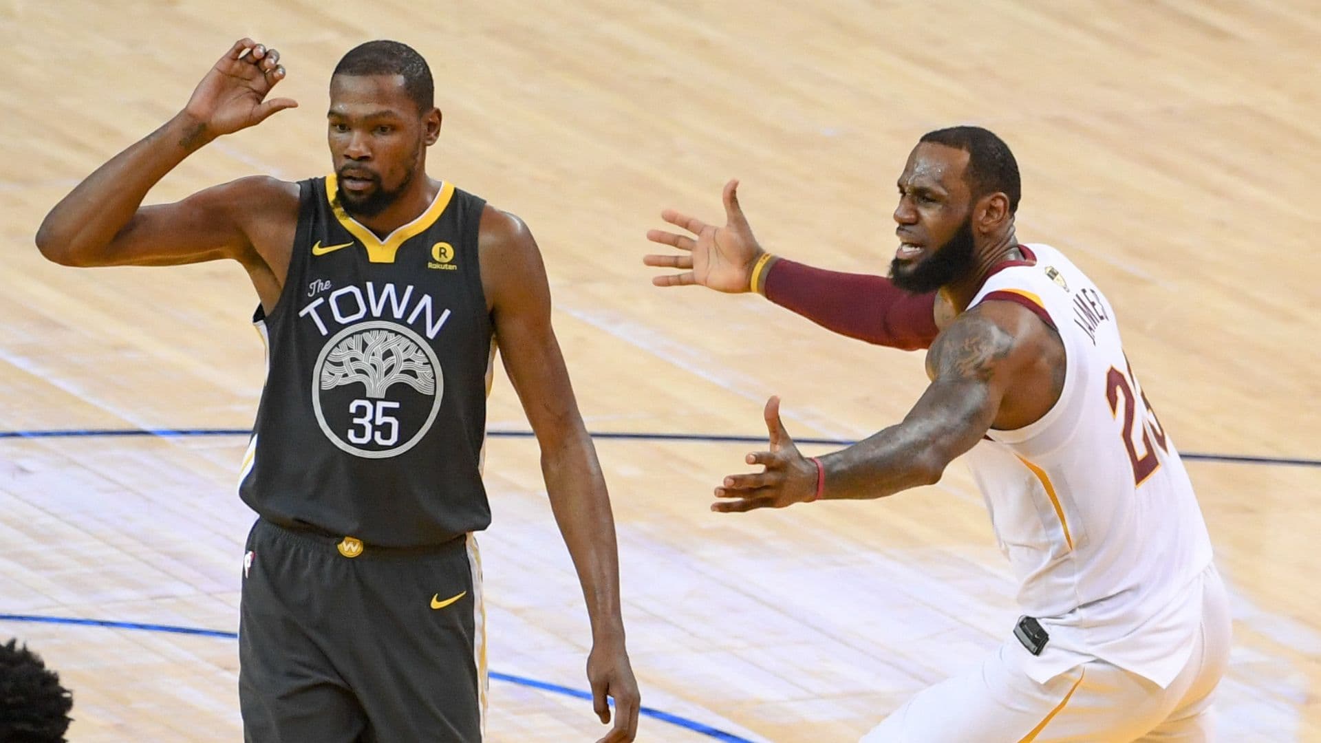 June 3, 2018; Oakland, CA, USA; Golden State Warriors forward Kevin Durant (35) and Cleveland Cavaliers forward LeBron James (23) react during the third quarter in game two of the 2018 NBA Finals at Oracle Arena.