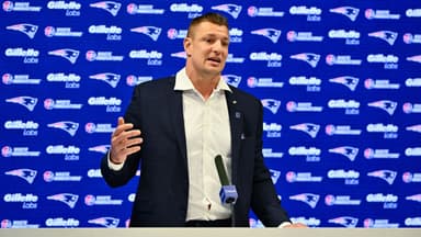 New England Patriots former player and current Fox Sports football analyst Rob Gronkowski speaks during a press conference where he signed a ceremonial one day contract at Gillette Stadium.