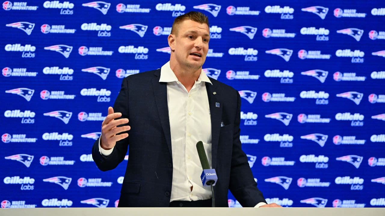 New England Patriots former player and current Fox Sports football analyst Rob Gronkowski speaks during a press conference where he signed a ceremonial one day contract at Gillette Stadium.