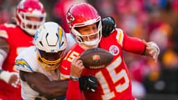 Los Angeles Chargers linebacker Odafe Oweh (98) sacks Kansas City Chiefs quarterback Patrick Mahomes (15) during the second half at GEHA Field at Arrowhead Stadium.