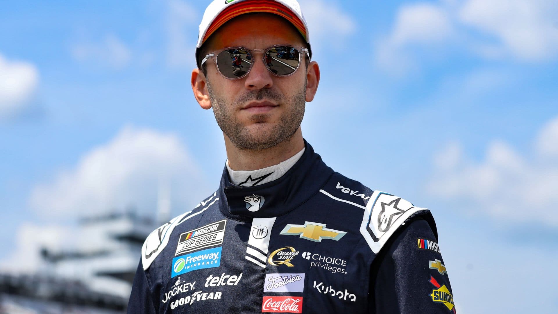 Jun 21, 2025; Long Pond, Pennsylvania, USA; NASCAR Cup Series driver Daniel Suarez walks on pit road during practice and qualifying for The Great American Getaway 400 at Pocono Raceway