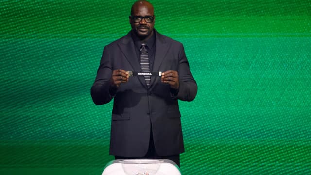 Dec 5, 2025; Washington, District of Columbia, USA; Shaquille O'Neal draws the card of Senegal for Group I during the FIFA World Cup 2026 Final Draw at John F. Kennedy Center for the Performing Arts