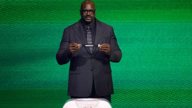 Dec 5, 2025; Washington, District of Columbia, USA; Shaquille O'Neal draws the card of Senegal for Group I during the FIFA World Cup 2026 Final Draw at John F. Kennedy Center for the Performing Arts