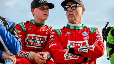 Former NASCAR Cup Series champion Kevin Harvick, center, right, and his son Keelan, 13, look on before the two raced in the 13th annual Masters of the Pros 200 race