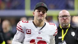 San Francisco 49ers quarterback Brock Purdy (13) leaves the field after the game against the Indianapolis Colts at Lucas Oil Stadium.
