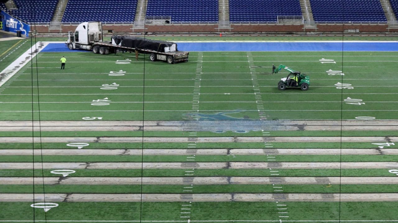 Work begins on the field at Ford Field in Detroit on Thursday, Jan. 26, 2023. The Lions are making the switch from a slit-film turf to a monofilament field turf, which is the most grass-like surface of the turf that is used in NFL stadiums. Fordfield 012623 Es02