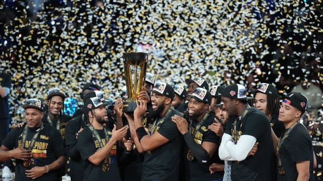 Dec 16, 2025; Las Vegas, Nevada, USA; New York Knicks center/forward Karl-Anthony Towns (32) and guard Jalen Brunson (11) hold the the Emirates NBA Cup trophy after victory over the San Antonio Spurs at T-Mobile Arena. Mandatory Credit: Kirby Lee-Imagn Images