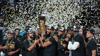 Dec 16, 2025; Las Vegas, Nevada, USA; New York Knicks center/forward Karl-Anthony Towns (32) and guard Jalen Brunson (11) hold the the Emirates NBA Cup trophy after victory over the San Antonio Spurs at T-Mobile Arena. Mandatory Credit: Kirby Lee-Imagn Images