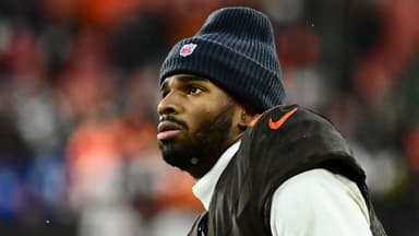 Cleveland Browns quarterback Shedeur Sanders (12) watches from the sidelines late in the fourth quarter against the Tennessee Titans at Huntington Bank Field.