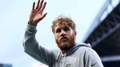 Seattle Seahawks wide receiver Cooper Kupp (10) waves to fans before the game against the Los Angeles Rams at Lumen Field.
