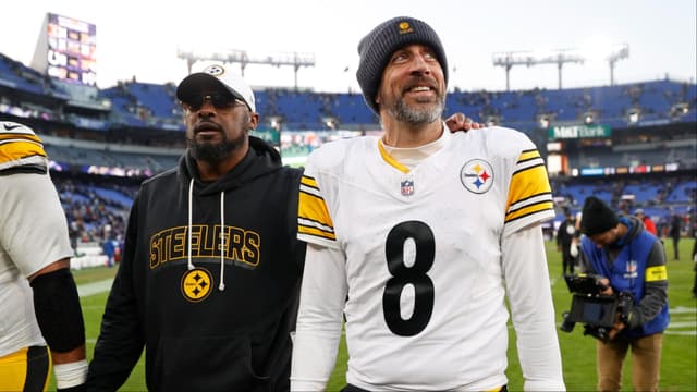 Pittsburgh Steelers head coach Mike Tomlin and quarterback Aaron Rodgers (8) walk off the field after the game against the Baltimore Ravens at M&T Bank Stadium.