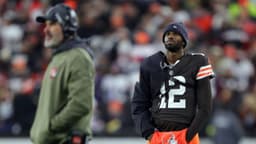 Cleveland Browns quarterback Shedeur Sanders (12) waits for his opportunity as head coach Kevin Stefanski watches Dillon Gabriel lead the offense during the first half of an NFL football game at Huntington Bank Field, Nov. 16, 2025, in Cleveland, Ohio.