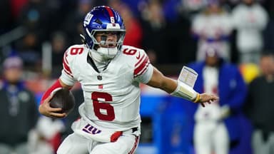 New York Giants quarterback Jaxson Dart (6) runs with the ball during the second quarter against the New England Patriots at Gillette Stadium.