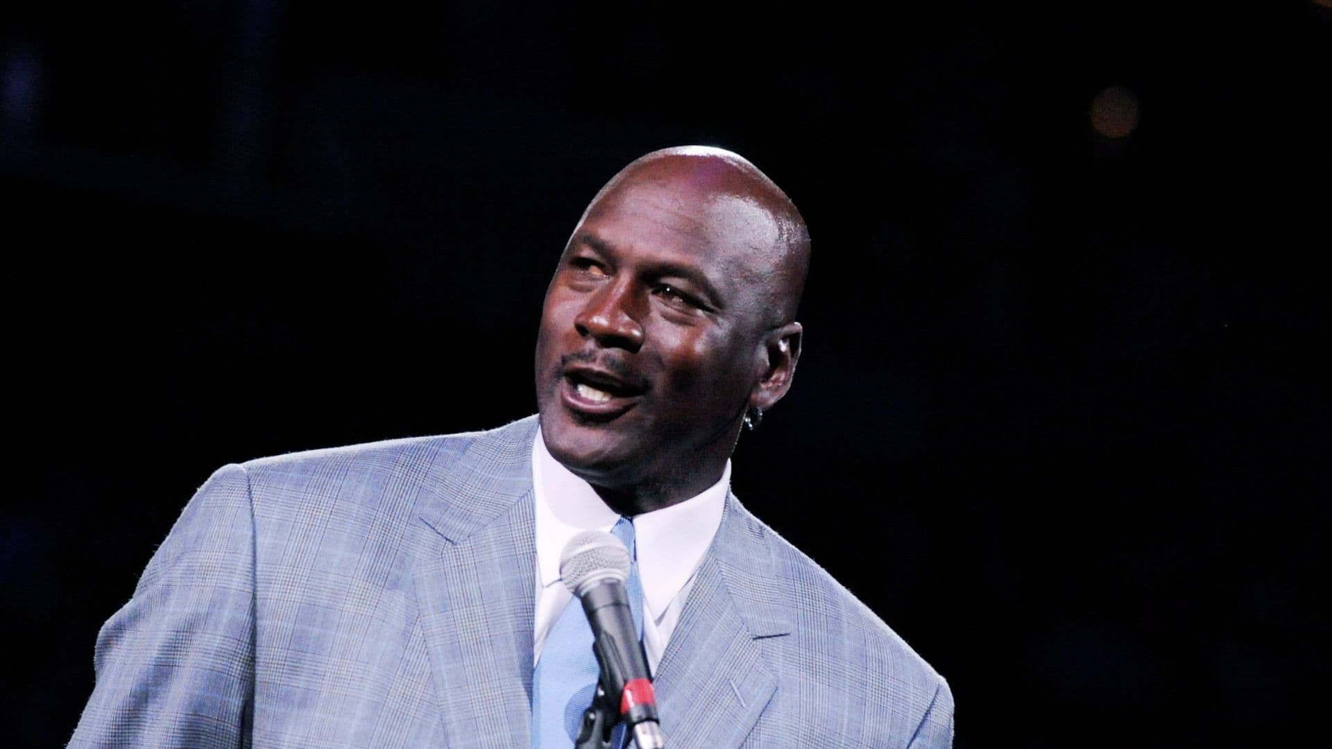 Dec 21, 2013; Charlotte, NC, USA; Charlotte Bobcats owner Michael Jordan unveils the new Charlotte Hornets logo at halftime during the game against the Utah Jazz at Time Warner Cable Arena