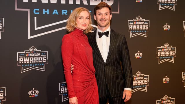 Nov 22, 2024; Charlotte, NC, USA; NASCAR Cup Series driver Daniel Suarez and wife Julia Piquet during the NASCAR Awards Banquet at Charlotte Convention Center.
