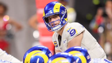 Los Angeles Rams quarterback Matthew Stafford (9) at the line of scrimmage against the Atlanta Falcons in the second quarter at Mercedes-Benz Stadium.