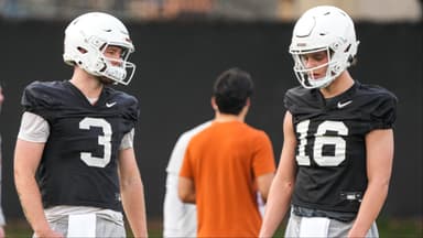 Texas quarterbacks Arch Manning (16) and Quinn Ewers talk during the team's first spring practice of 2023 at the Frank Denius Fields. 2023-03-06-manning-ewers