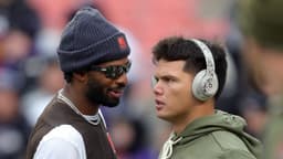 Browns quarterbacks Shedeur Sanders and Dillon Gabriel talk before a game, Nov. 16, 2025.