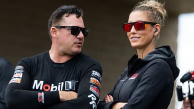 May 18, 2025; Joliet, IL, USA; NHRA top fuel driver Tony Stewart (left) with wife Leah Pruett during the Route 66 Nationals at Route 66 Raceway.