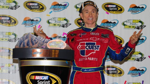 Apr 18, 2009; Avondale, AZ, USA; NASCAR Sprint Cup Series driver Mark Martin celebrates after winning the Subway Fresh Fit 500 at Phoenix International Raceway