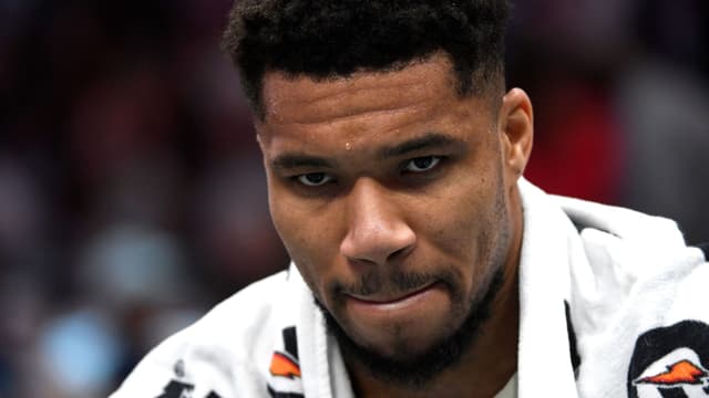 Dec 29, 2025; Charlotte, North Carolina, USA; Milwaukee Bucks forward Giannis Antetokounmpo (34) in a time out during the second half against the Charlotte Hornets at the Spectrum Center.